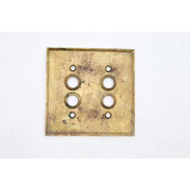 Vintage double gang four push button switch cover made of brass with a polished brass finish. Made by The Perkins Electric...