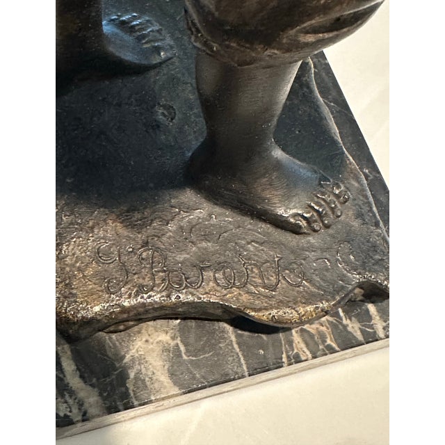 19 th Century bronze of a young boy playing a musical instrument on a marble base from Gabrielle Parente. Born 1875-1899,...