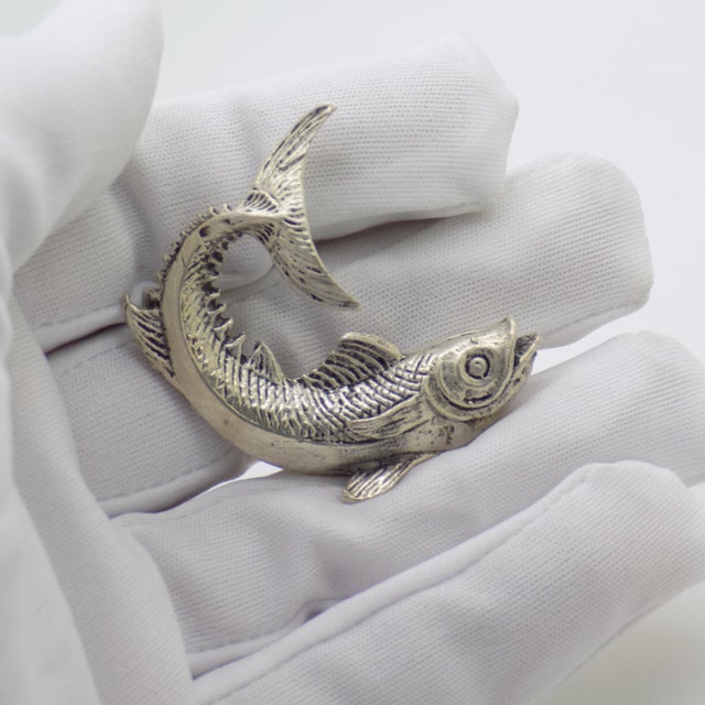 Rare vintage solid silver figurine depicting a fish with an arched raised tail, handcrafted in Italy during the 1950s to...