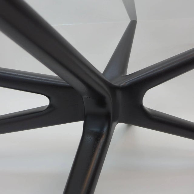 Handcrafted in New York by Spark Interior. It can be finished in different finishes; Starphire glass top with polished edges.