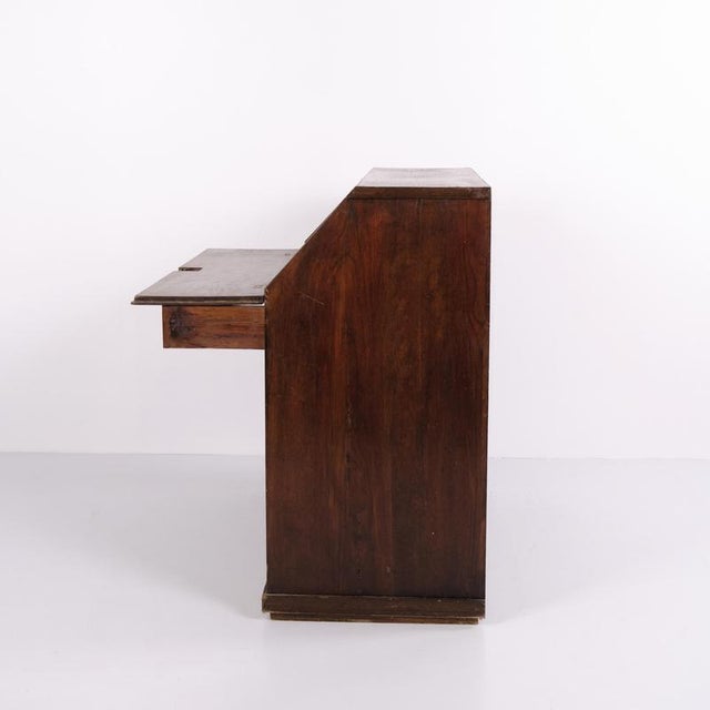 Antique Late Empire secretary desk crafted from oak with decorative inlay and brass fittings. The desk was made in the...