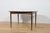 This extending dining table was manufactured by the British furniture maker White & Newton during the 1960s. The piece is...