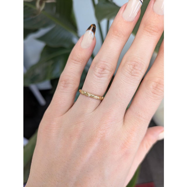 Delicate vines of gold wrap your finger in nature’s quiet luxury, kissed with a hint of diamond sparkle. Elegant yet...