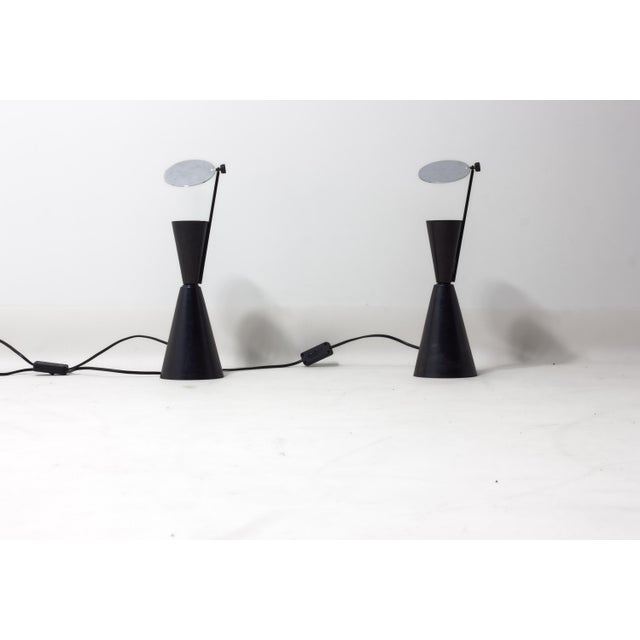 Pair of Spanish diabolo table lamps from the 1980s. Black metal bodies with a clean, geometric silhouette, built from two...