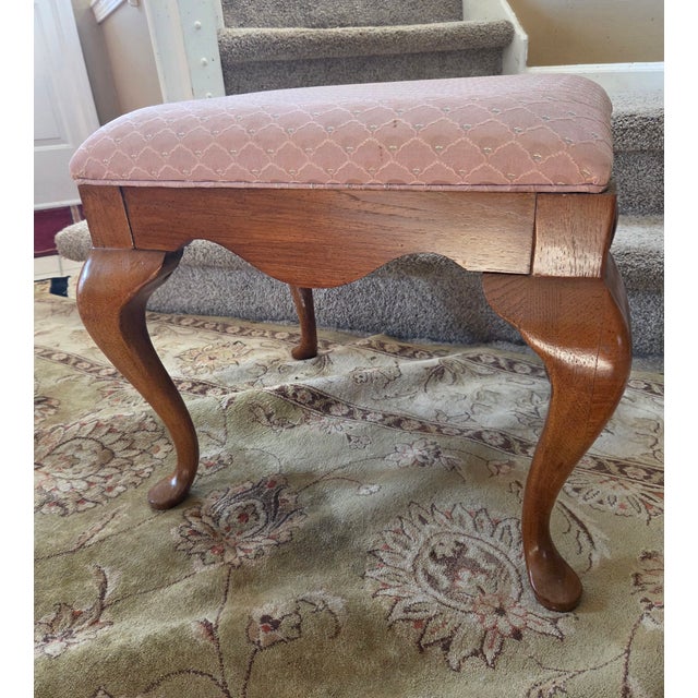 Vintage queen-anne style with cabriole legs. Very sturdy with warm finish and original woven upholstery.