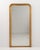 A 19th century French floor mirror in the Louis Philippe style, defined by its tall vertical format and softly curved...