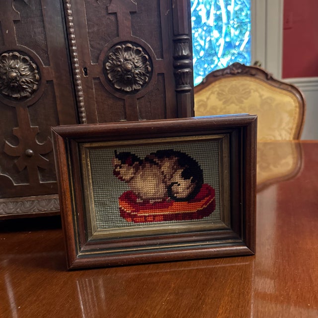 A lovely British Victorian. Handmade needlepoint of a cat on a red pillow with a blue background inside a deep mahogany...