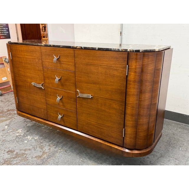 Design Plus Gallery presents a Sideboard from John Richard Fine Furniture. The gorgeous piece showcases a design with...