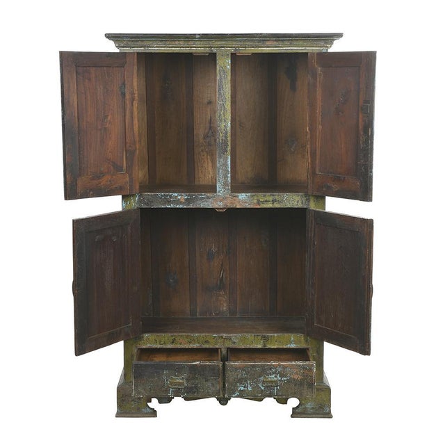 Wooden cabinet with green and blue patina. This piece is designed in the style of the selected designer and/or manufacturer