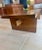 This hefty piece would make a fabulous entryway bench! Nice contrasting wood design on top surface. I believe it is oak...