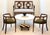 An elegant pair of Italian Mid-Century walnut horseshoe rail back armchairs. The low profile and petite scale make them...