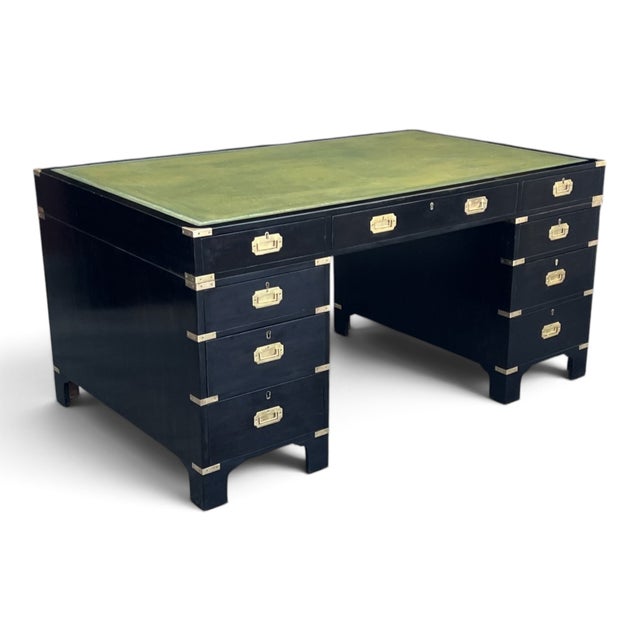 Rich wood grain, a striking ebonized finish, classic campaign brass detailing, and a luxurious original leather writing...