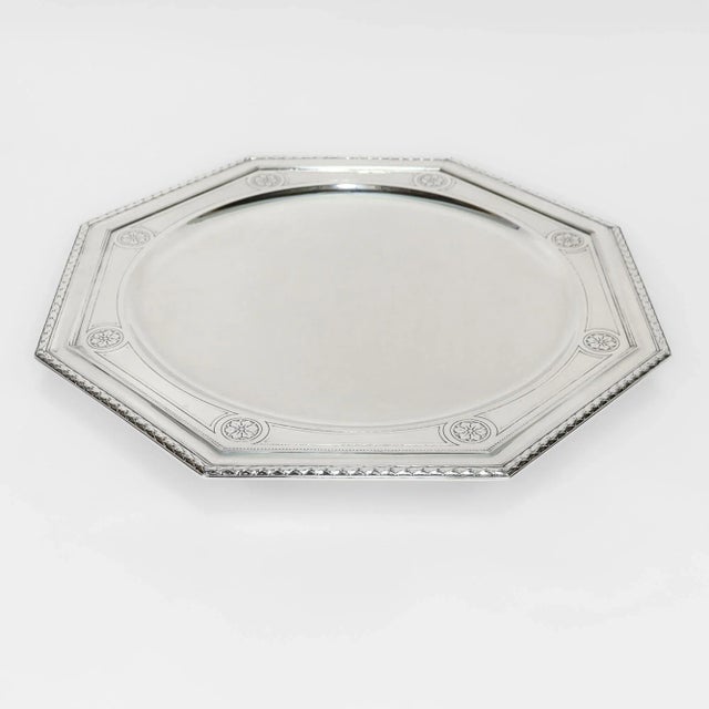 A fine signed antique silver footed plate or tray. By Tiffany & Co. In sterling silver. With laurel wreath border and...