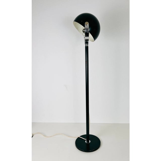 A midcentury floor lamp made in Germany in the 1960s. It is fascinating with its Space Age design and adjustable head. The...