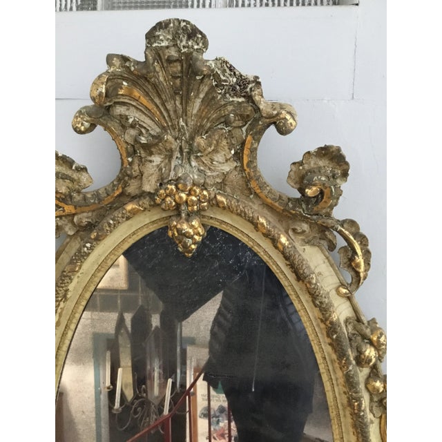 This Victorian mirrors imperfections make it beautiful . Tall oval shape , distressed gold and “cloudy” mirror everything...