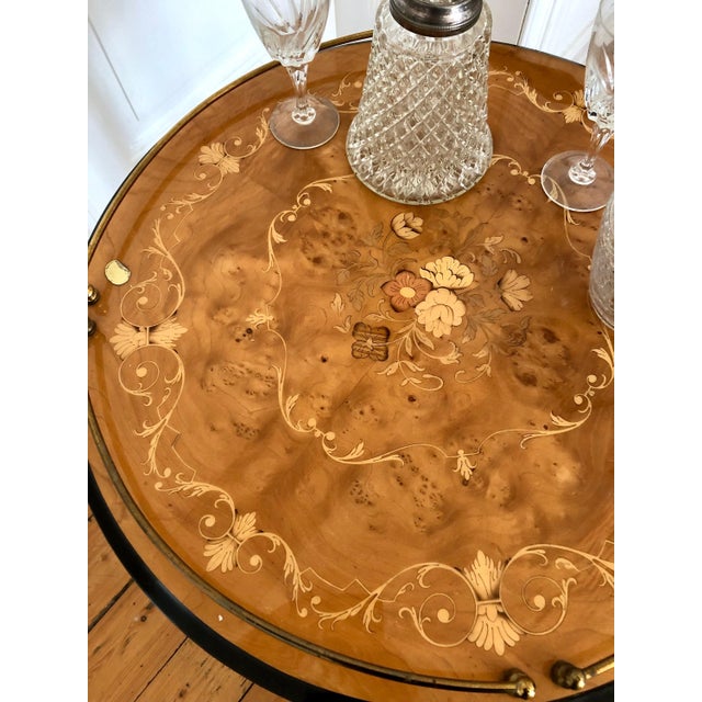 Elegant, high-quality vintage luxury trolley with inlays and polished brass embellishments. integrated bottle holders for...