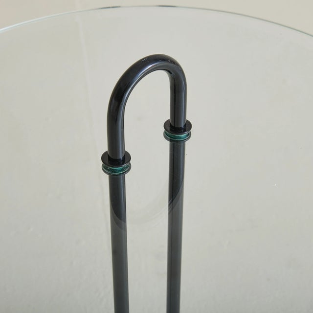 Sold and priced individually. A 1980s Italian Modern side table attributed to Vico Magistretti for Cattelan Italia. The...