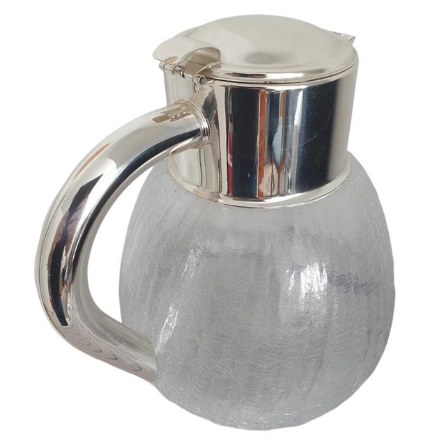 Often copied, never equaled. Here's the original from the 1960s: The Cold Duck by QUIST. Crystal carafe with silver-plated...