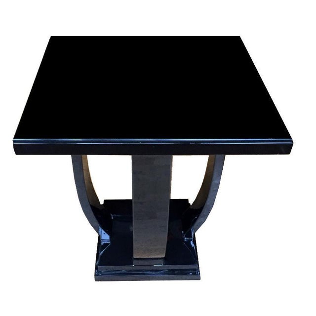 Art Deco side table France around 1930. Tulip-shaped struts on a square base support the square table top. Wood painted...