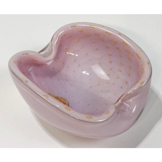 Mid century Italian Murano hand blown glass bowl in pink opalescent glass with gold flecks. Beautifully executed and in...