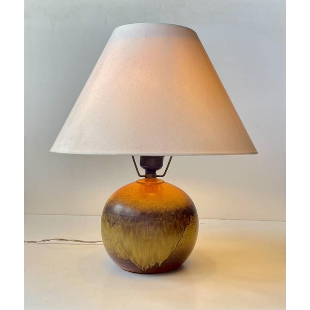 Playfully glazed spherical pottery table light in the style of Jean Besnard. Designed and created by anonymous...