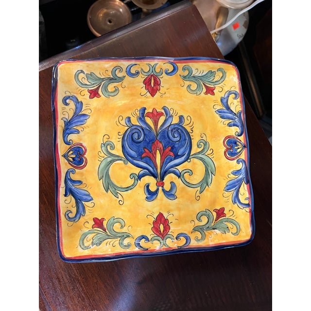 Enhance your dining experience with the Maxcera Yellow Talavera Square Plate, a stunning piece of hand-painted ceramic...