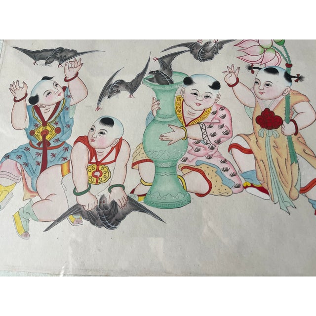 This late 19th century-early 20th century Chinese artwork depicts playful children painted on silk. The Chinese children...