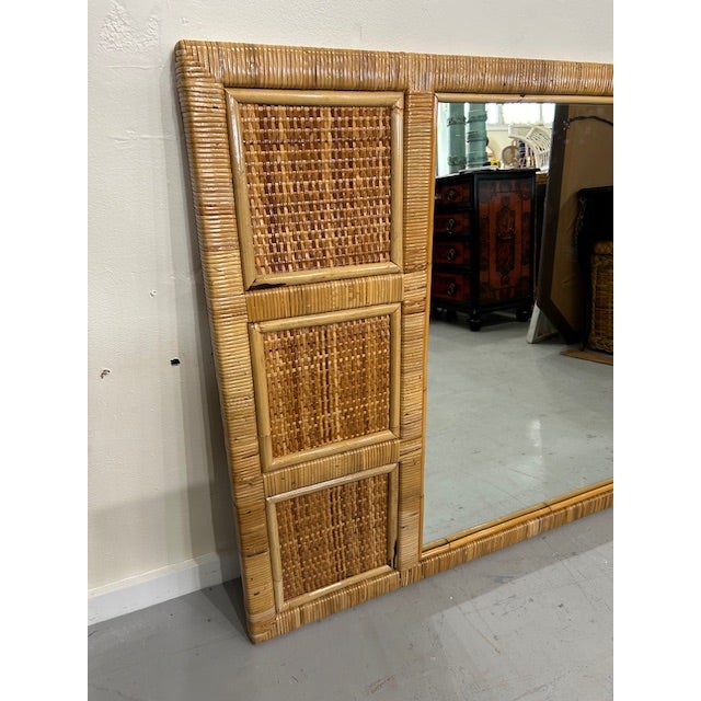 20th Century cane rattan wrapped woven mirror to hang in your space for a coastal touch.