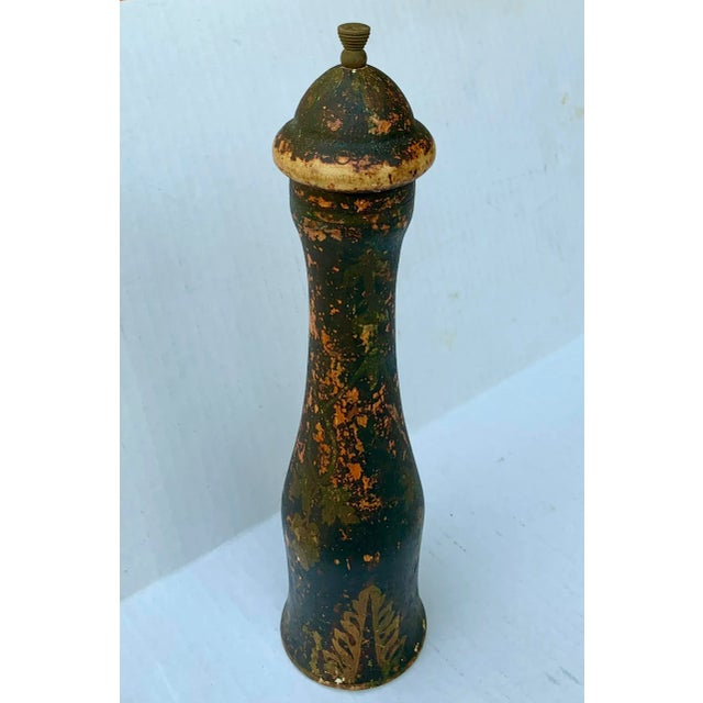 Vintage tall wooden pepper mill grinder for grinding peppercorns, made in Italy. Shows desirable signs of wear to the...