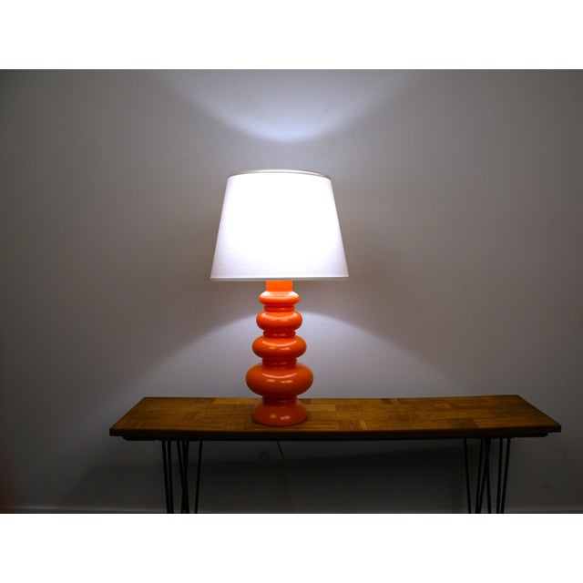 Rare large swedish orange art glass table lamp by gustav leek for orrefors, 1960s. this is the only one in orange that we...