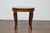 An Italian walnut round top table with cabriole legs. This Italian walnut round top table captures the eye with its...
