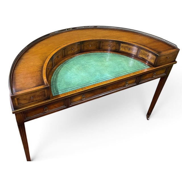 Vintage leather top Carlton House desk, handcrafted in New York by J. Zonon. The mahogany case is accented with burl...