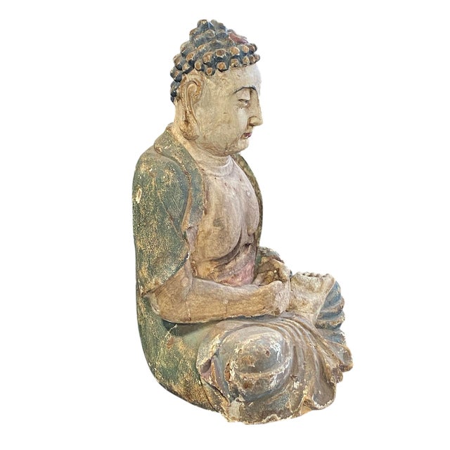 This exquisite vintage wooden statue of Lord Buddha is a superb representation of South Asian art. Hand carved and...