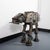Large metal sculpture composed of various welded metal parts and tools inspired by Star Wars AT-AT Imperial walker.