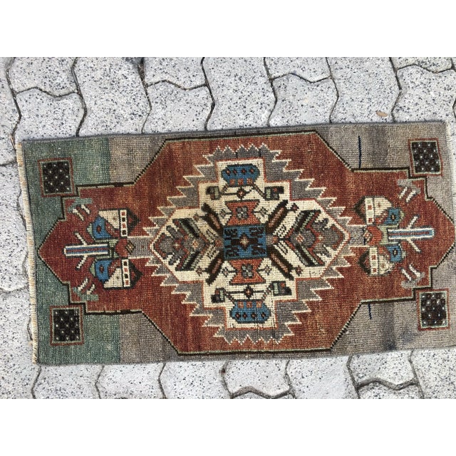 This is a vintage Turkish Oushak rug from the 1960s. The piece was hand-knotted.