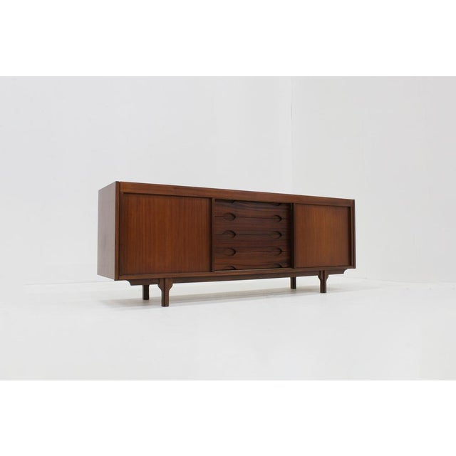 Vintage sideboard from the 1960s Italy. Large mid century teak sideboard with plenty of storage space with sliding doors...