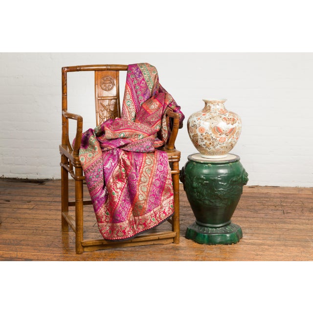 A 19th century Annamese ceramic garden seat from Vietnam with green glaze, deer in scrolling foliage motifs and shaped...