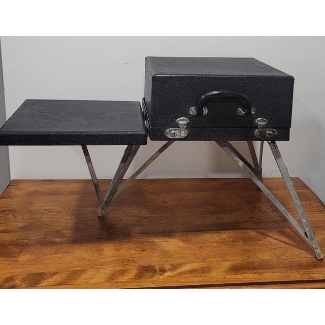 The Underwood Champion Portable Typewriter from the 1940s is a vintage collectible that exudes nostalgia and charm. With...