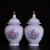 A beautiful pair of Chinese white glazed porcelain covered jars. The body features a subtle, intricately incised (anhua)...