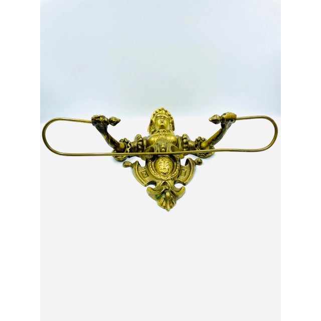 This wonderful cast brass figural wall mount kitchen or bathroom towel holder has very fine detailing and is in remarkable...