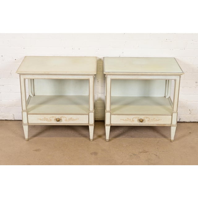 A gorgeous pair of French Regency Louis XVI style bedside tables or end tables By John Widdicomb USA, Circa 1960s Solid...