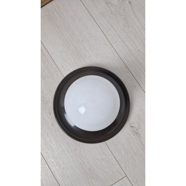 Wall Lamp with Brown Light Ball by Achille and Piergiacomo Castiglioni for Arteluce, 1970s, in Very Good conditions....