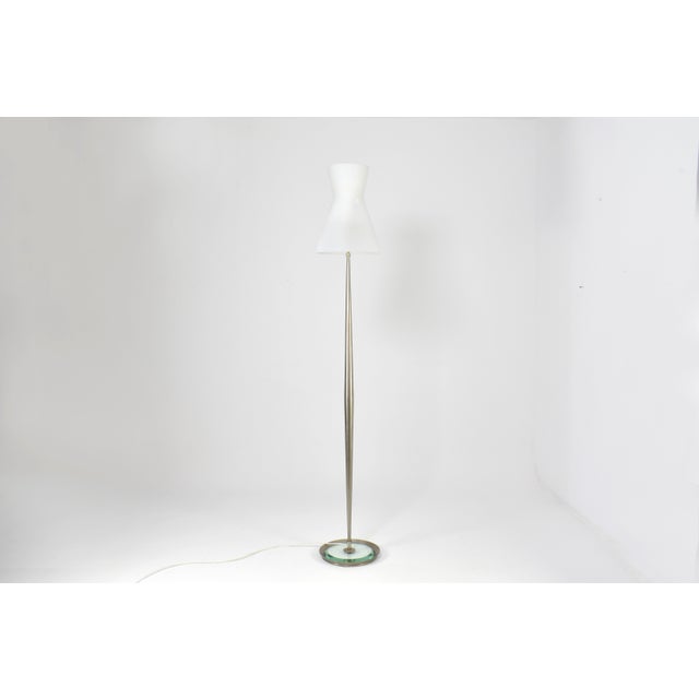 Iconic Model 2156 floor lamp designed by Max Ingrand for Fontana Arte, Italy, circa 1958. The lamp features its original...