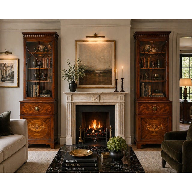 A superb and highly decorative pair of antique Regency mahogany inlaid bookcases of exceptional quality and elegant...