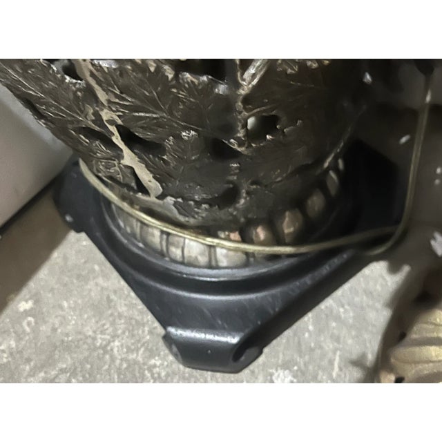 Solid metal lamp, not sure what the metal is but it’s non-ferrous, with a black and gold shade. The lamp is 26 inches high...