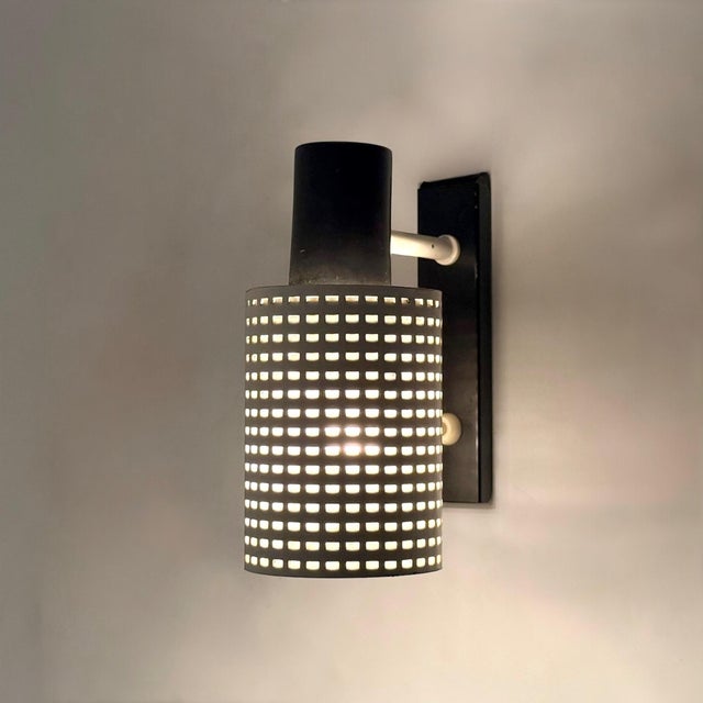 Wall reading lamp produced by hala in the netherlands during the 1970s. the lamp is characterized by its modernist...