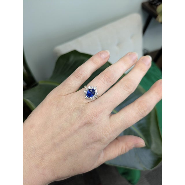 This stunning 4ct blue sapphire ring features a rich 8×6mm center stone accented with sparkling natural diamonds for...