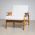 A pair of Danish Mid-Century lounge chairs from the 1950s, crafted from honey-colored beechwood. The distinctively shaped...