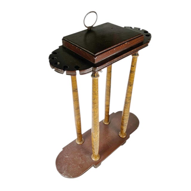 Very old collector’s spoon or pipe holder featuring four vertical columns. This sculptural and functional object shows age...