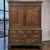 A beautifully proportioned late 18th century English Georgian oak linen press cupboard on chest, offering an exceptional...
